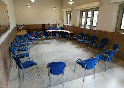 Chairs in the Chapter House arranged in a circle.