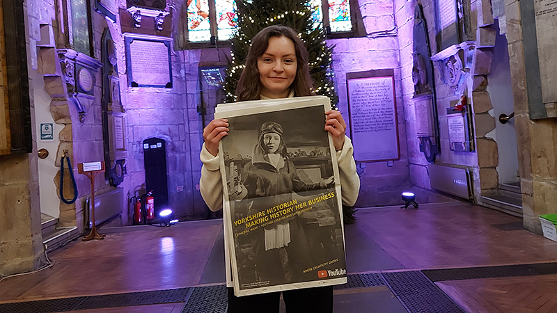 Catherine Warr in the Cathedral with her photo advert in the weekend’s edition of The Sunday Times