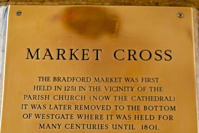 A close up of the Market Cross plaque in the Kirkgate Centre