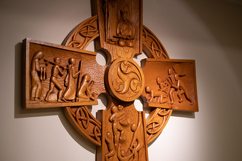 A close-up of St. Aidan's Cross on the wall of St. Aidan's Chapel