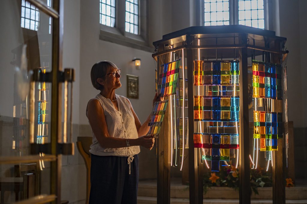 Linda Baines begins to set up 'Woven Lives' in the Holy Spirit Chapel of Bradford Cathedral.
