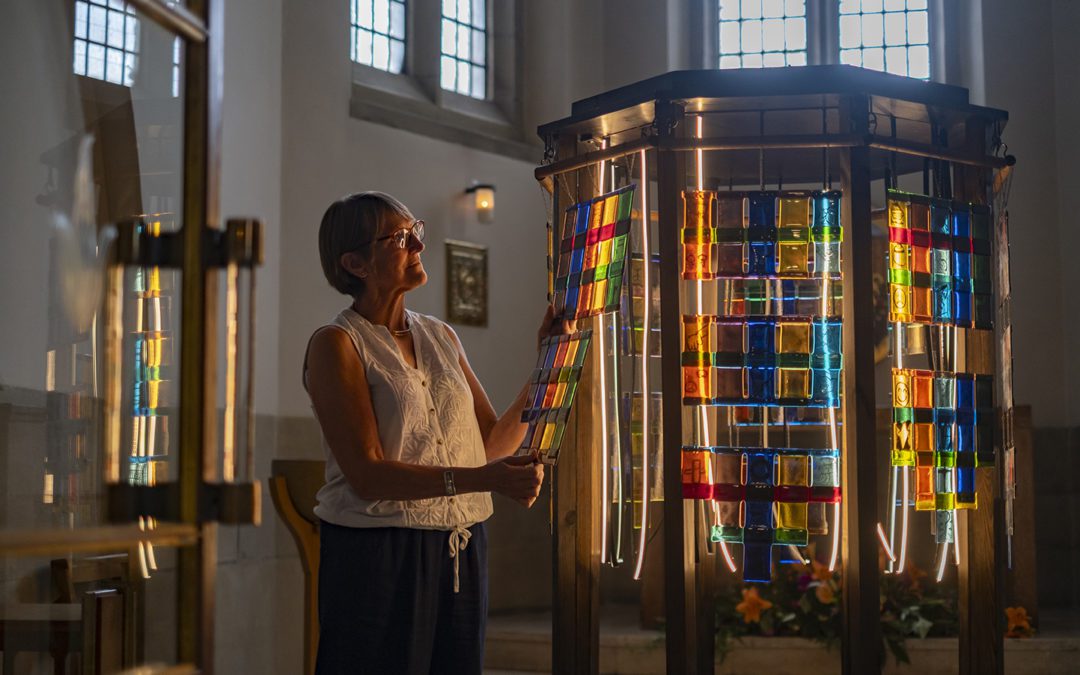 Linda Baines begins to set up 'Woven Lives' in the Holy Spirit Chapel of Bradford Cathedral.